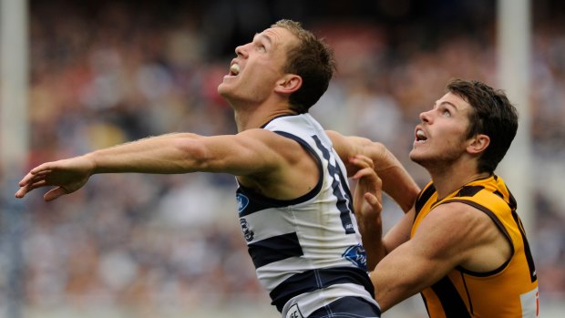Isaac Smith (right) against Geelong  in 2013