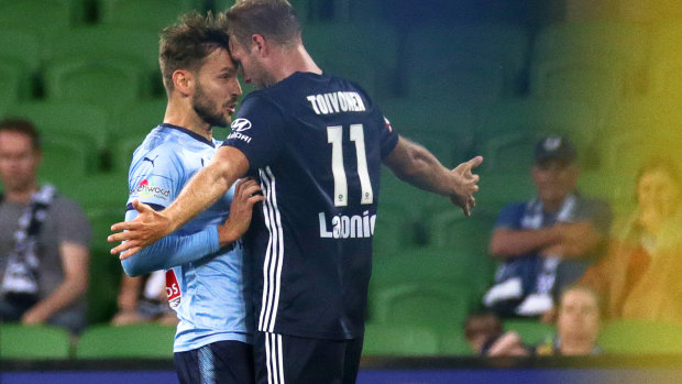 Plenty of feeling: Victory's Ola Toivonen and Milos Ninkovic of Sydney FC clash during the last Big Blue.