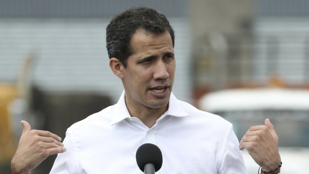 Venezuela's self-proclaimed interim president Juan Guaido speaks in front of the warehouse housing US humanitarian aid destined for Venezuela, in Cucuta, Colombia, on Saturday.