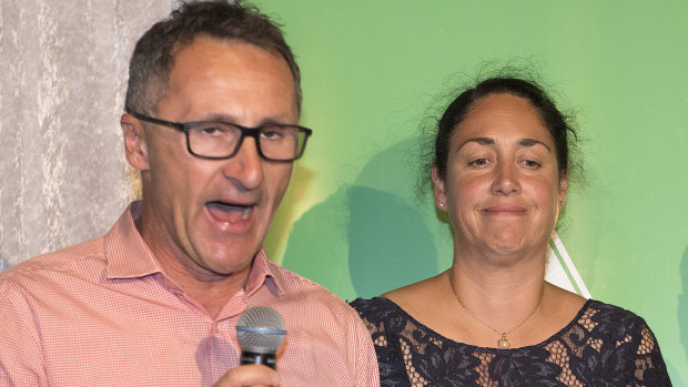 Standing with candidate Alex Bhathal, Greens leader Richard Di Natale concedes defeat in Batman.