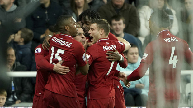 Significant: Liverpool players celebrate Divock Origi's late winner.
