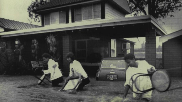D'Leanne Lewis, Teresa Begg and Yvette Lewis evacuate their Toongabbie home, August 5, 1986.
