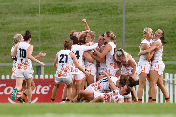 GWS players celebrate after the final siren.
