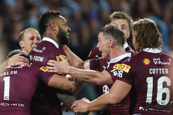 Hamiso Tabuai-Fidow (left) celebrates a win in the opening State of Origin game.