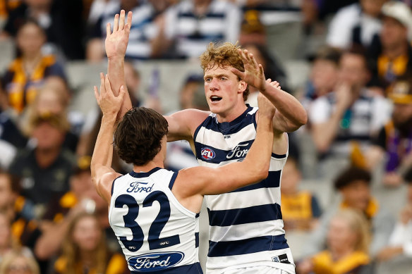 Geelong celebrate a goal.