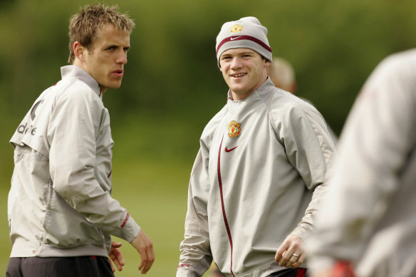 Phil Neville with Wayne Rooney during their time at Manchester United.