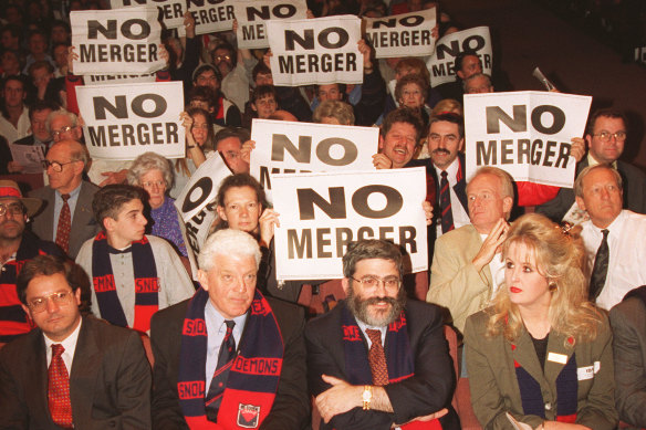 Melbourne supporters at an anti-merger meeting at Dallas Brooks Hall - Brian Dixon and Joseph Gutnick (right) are pictured at the front.
