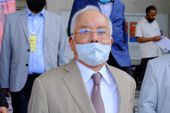 Najib Razak, Malaysia's former prime minister, centre, will learn the outcome of his first trial on Tuesday.