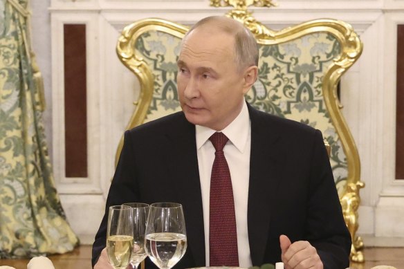 Russian President Vladimir Putin dines at the Kremlin. 