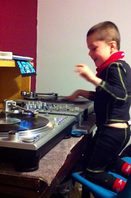 Cooper Smith as a child practising on his Dad’s decks in 2012.