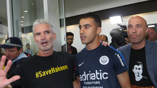 Former Socceroo Craig Foster with refugee footballer Hakeem al-Araibi at Melbourne International Airport on Tuesday,
