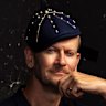 John Travolta wearing a beret in Cannes and fashion editor Damien Woolnough testing the trend.