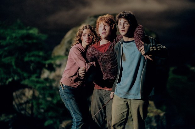 Actor, Emma Watson (L) Rupert Grint (M) and Daniel Radcliffe (R) on the set of the film 'Harry Potter and The Prisoner of Azkaban', London, England, 2003