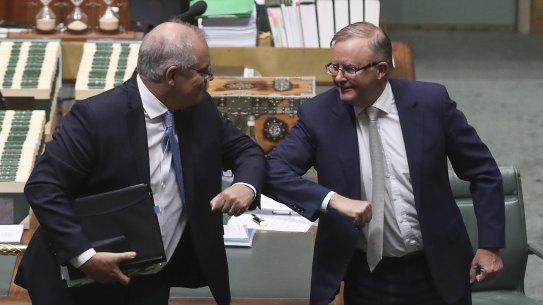 Prime Minister Scott Morrison and Opposition Leader Anthony Albanese exchange an elbow bump at the end of the parliamentary year for 2020.