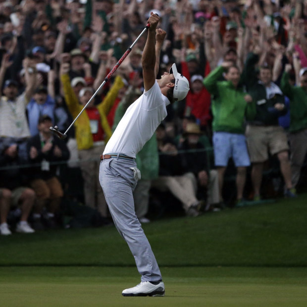 A jubilant Adam Scott celebrates his 2013 Masters win on the second play-off hole at Augusta National.