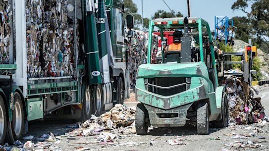 A truck at the Hume recycling facility is loaded with bales of compressed recyclables. Staff at the centre said the bales were headed "to market".