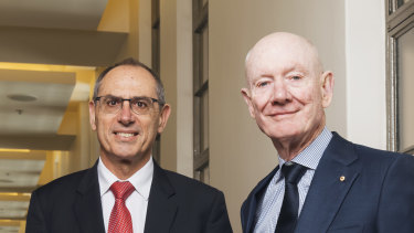 Worley CEO Andrew Wood (left) received a $480,000 cash bonus for completing the takeover of Jacobs' energy business approved by chairman John Grill (right.)