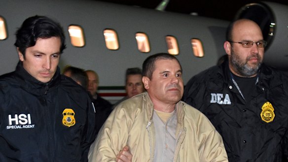 US authorities escort Mexican drug lord Joaquin “El Chapo” Guzman from a plane in New York last year.