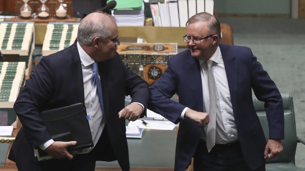 Prime Minister Scott Morrison and Opposition Leader Anthony Albanese bump elbows at the end of the year.