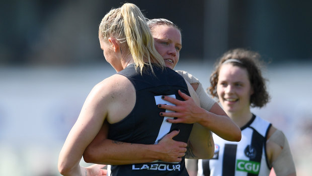 No hard feelings: Tayla Harris and Stacey Livingstone embrace after the match.