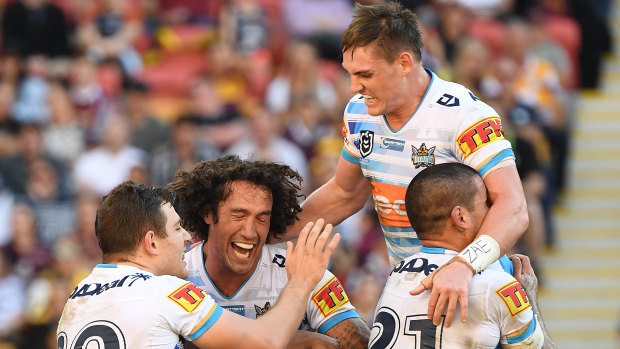 Titans players celebrate Tyrone Roberts' try during their round 13 win over the Broncos at Suncorp Stadium last month.