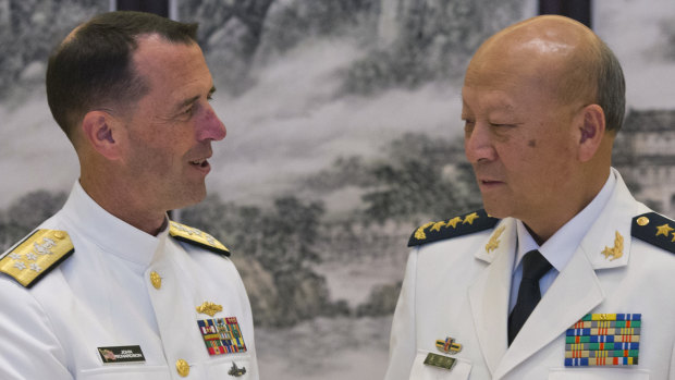 US Chief of Naval Operations Admiral John Richardson, left, and Commander of the Chinese navy Admiral Wu Shengli in 2016.