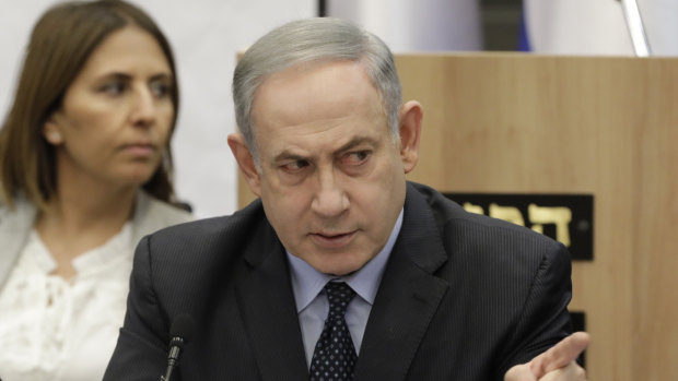 Israeli Prime Minister Benjamin Netanyahu gestures during a meeting with his nationalist allies and his Likud party members at the Knesset, Israeli Parliament, in Jerusalem.