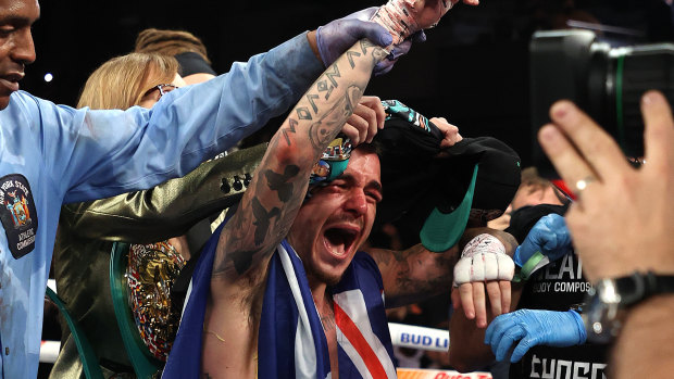 George Kambosos celebrates his split-decision win against Teofimo Lopez.