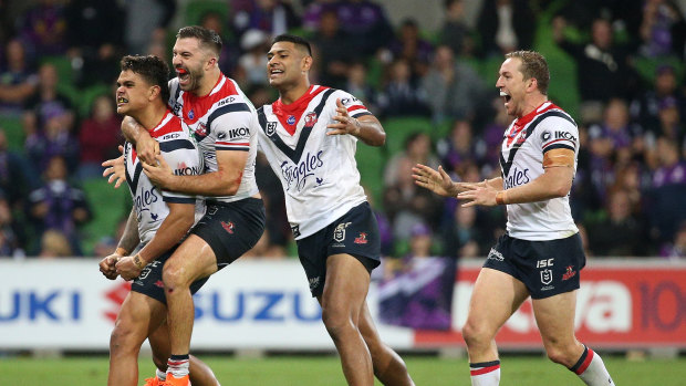 The Roosters celebrate Latrell Mitchell's (left) match-winner.