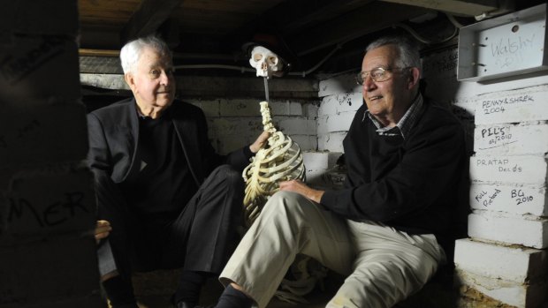 Ross Thomas, left, and Peter Anderson share a yarn with a skeleton in the ‘room within a room’.
