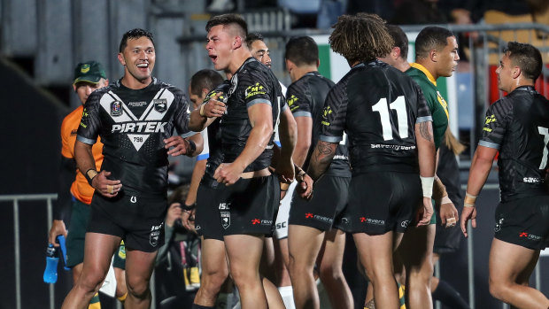 Class act: Joey Manu celebrates his try for New Zealand.