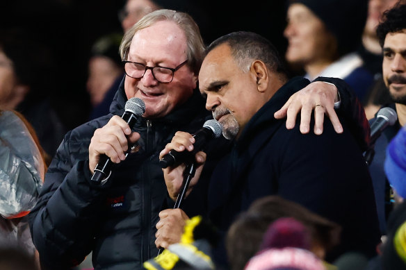 Former Essendon coach Kevin Sheedy and Michael Long perform at half-time of the 2023 Dreamtime match at the MCG.