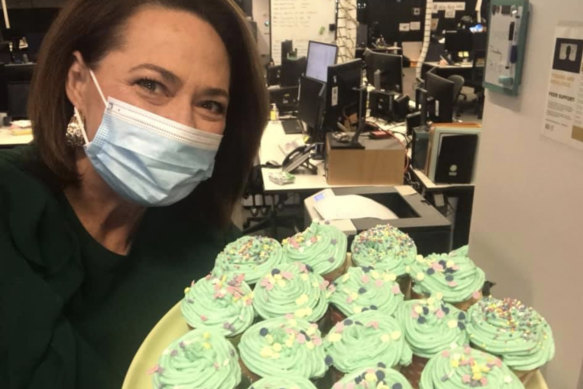 Millar shows off cupcakes made by the News Breakfast executive producer, Tyson Shine, in an attempt to buoy spirits.