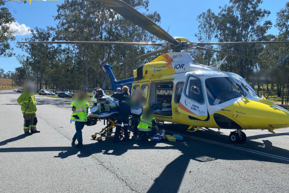 The LifeFlight helicopter had to land on the road nearby, while the QGAir landed in a nearby field.