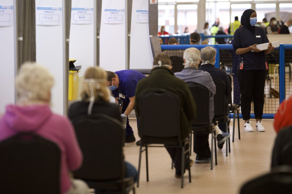 People wait for a jab at the Melbourne Showgrounds vaccination hub on Wednesday.