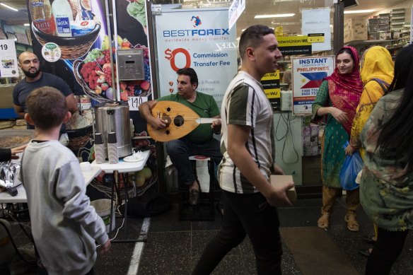 A man plays an old Arabic song to passersby.