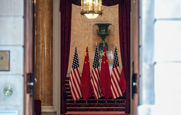 US and Chinese flags in the entrance during the trade talks at Lancaster House in London, UK.
