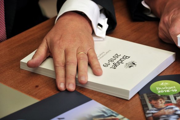 Scott Morrison with the 2018-19 budget that contained the seven-year tax plan.