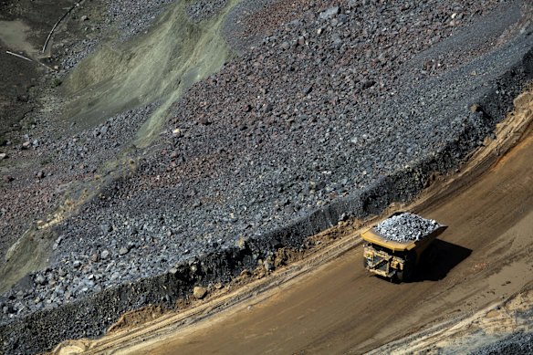 A mining truck carries diamond-bearing kimberlite rock away from the pit floor at the Jwaneng mine, operated by Debswana Diamond, a joint venture between De Beers and Botswana’s government.