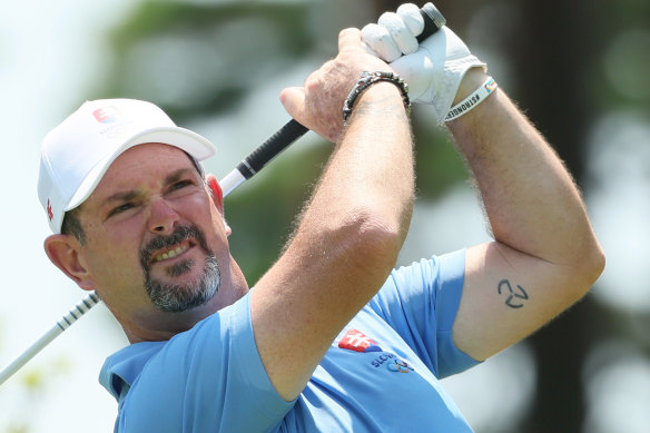 Rory Sabbatini of Slovakia, tattoo visible, plays his shot from the ninth tee during the final round of the men’s individual play at Tokyo’s Kasumigaseki Country Club on Saturday.