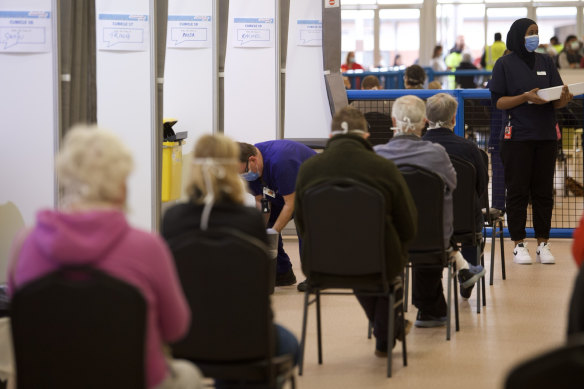 People wait for a jab at the Melbourne Showgrounds vaccination hub on Wednesday.
