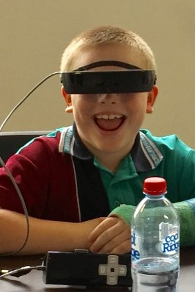 Max Geoghegan, the first Queenslander to receive a pair of eSight glasses.