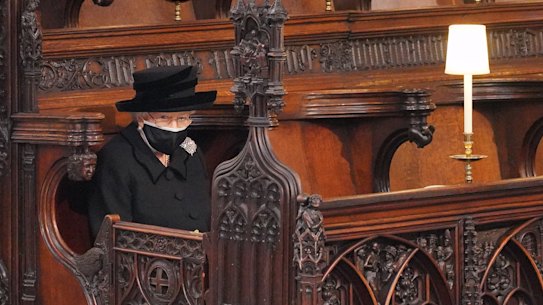 The Queen takes her seat ahead of the funeral.