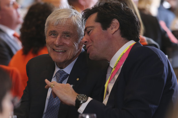 Kerry Stokes and AFL CEO Gillion McLachlan at the 2019 AFL Grand Final function at the MCG. The cancellation of live sports has bitten into Seven's advertising revenue.