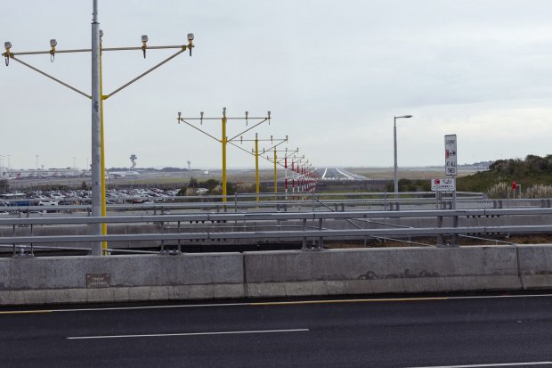 Light poles for the gateway motorway near Sydney Airport’s main north-south runway are only about three metres tall, less than a third the height of standard street lights.