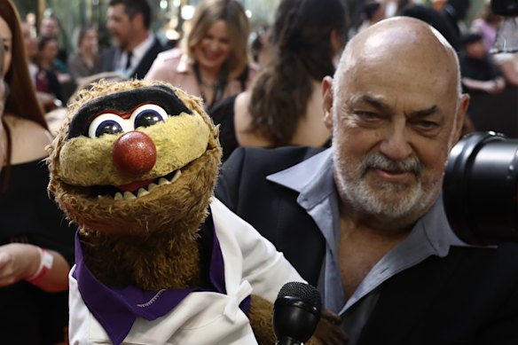 Jamie Dunn and puppet Agro at the ARIA Awards in 2019.