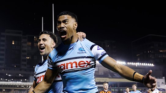 Ronaldo Mulitalo celebrates a try for Cronulla.