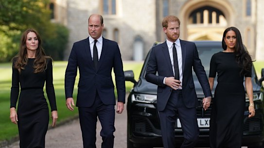 Catherine, the Princess of Wales, Prince William, the Prince of Wales, Prince Harry, the Duke of Sussex and Meghan, the Duchess of Sussex, walk towards the crowds at Windsor Castle.