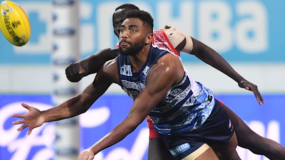 Target man: Esava Ratugolea of the Cats gets front position against Aliir Aliir at GMHBA Stadium in Geelong.