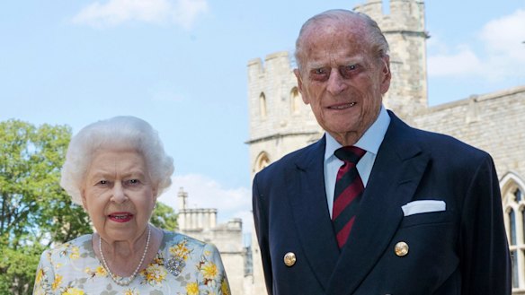 The Queen and Prince Philip pose for a photo in the quadrangle of Windsor Castle.